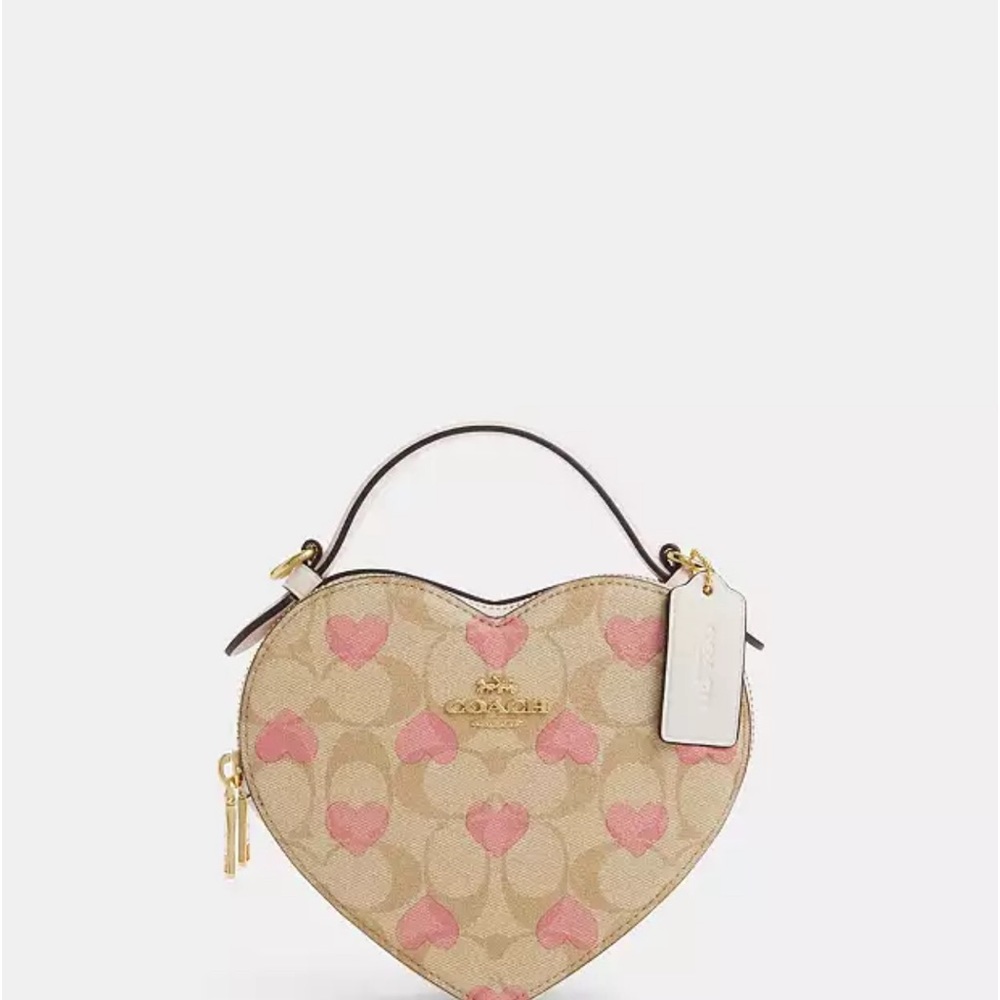 New
Heart Crossbody Signature Canvas Heart Print. W/FREE mystery makeup palette
